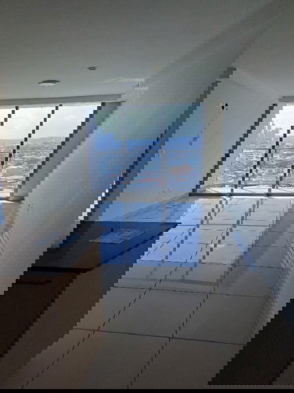 Spacious empty living room apartment with large windows and skyline views PH Torres de Castilla Carrasquilla Panama