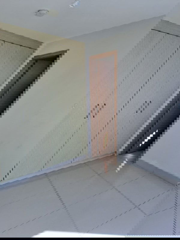 Bright bedroom with built-in closet and tiled floor in PH Torres de Castilla Carrasquilla Panama City