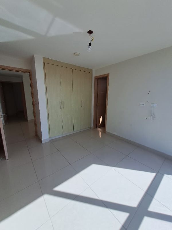 Modern kitchen with granite counters and wood cabinets PH Torres de Castilla Carrasquilla Panama