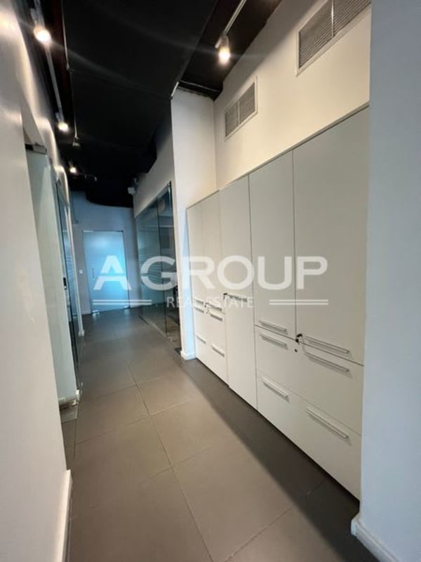 Modern hallway with built-in cabinets and glass partitions in Punta Pacifica Panama