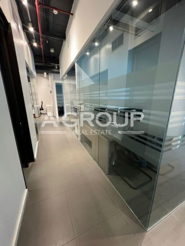 Shared coworking desk areas with windows at Punta Pacifica office for sale