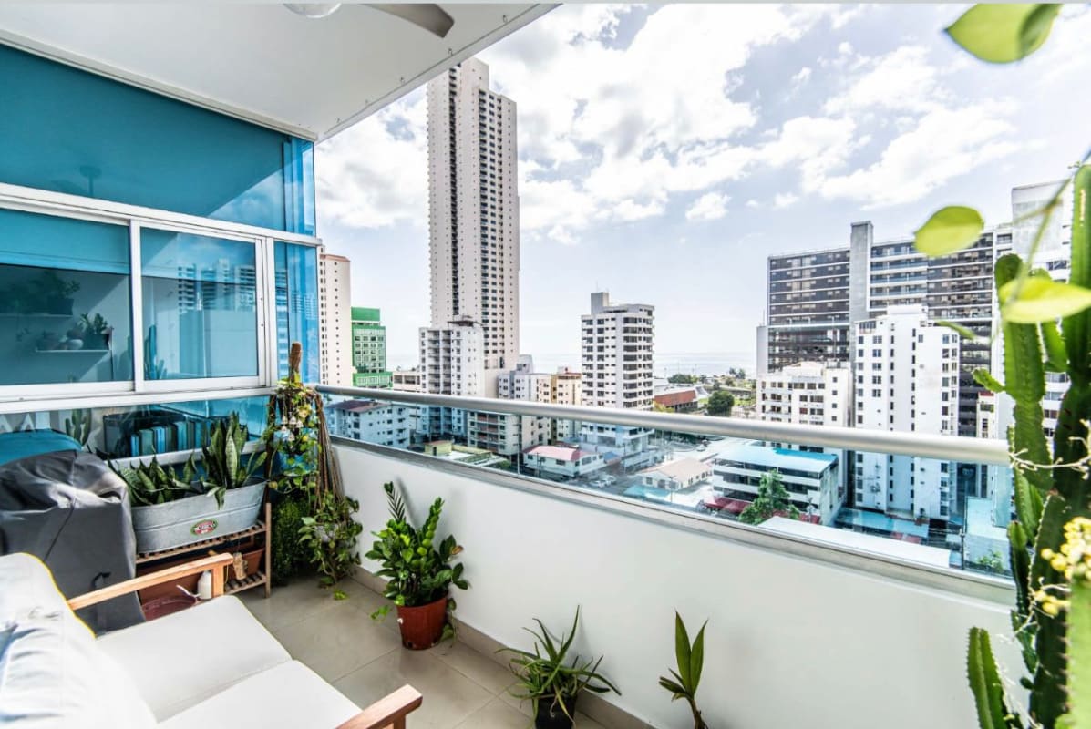 Contemporary dining area open to kitchen with modern lighting PH Ocean View Tower Panama City