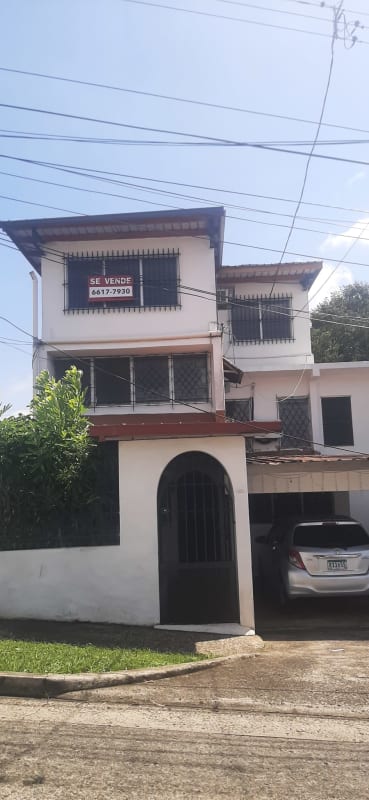 Large empty interior spaces with tile floors and fluorescent lights in Villa Cáceres house El Dorado Panama