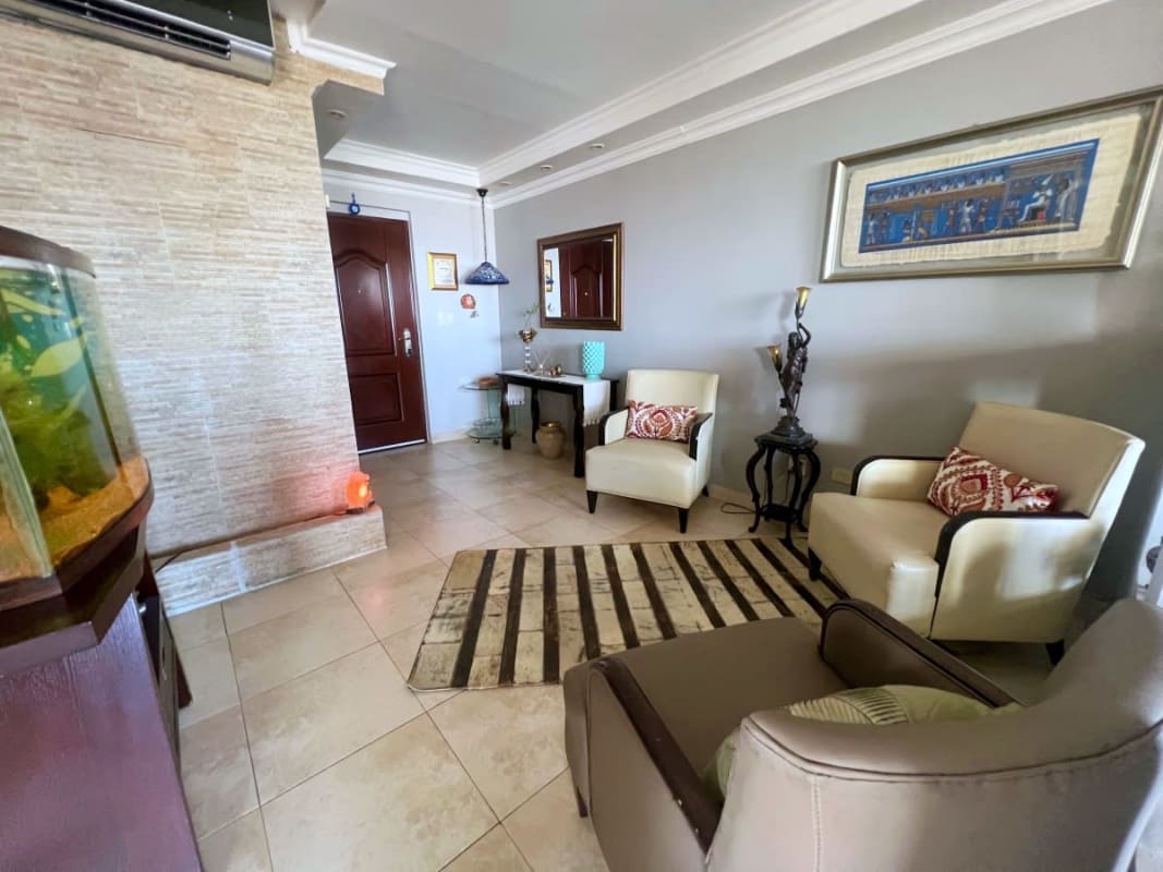 Penthouse bedroom with built-in wardrobe and panoramic city view in San Francisco Panama