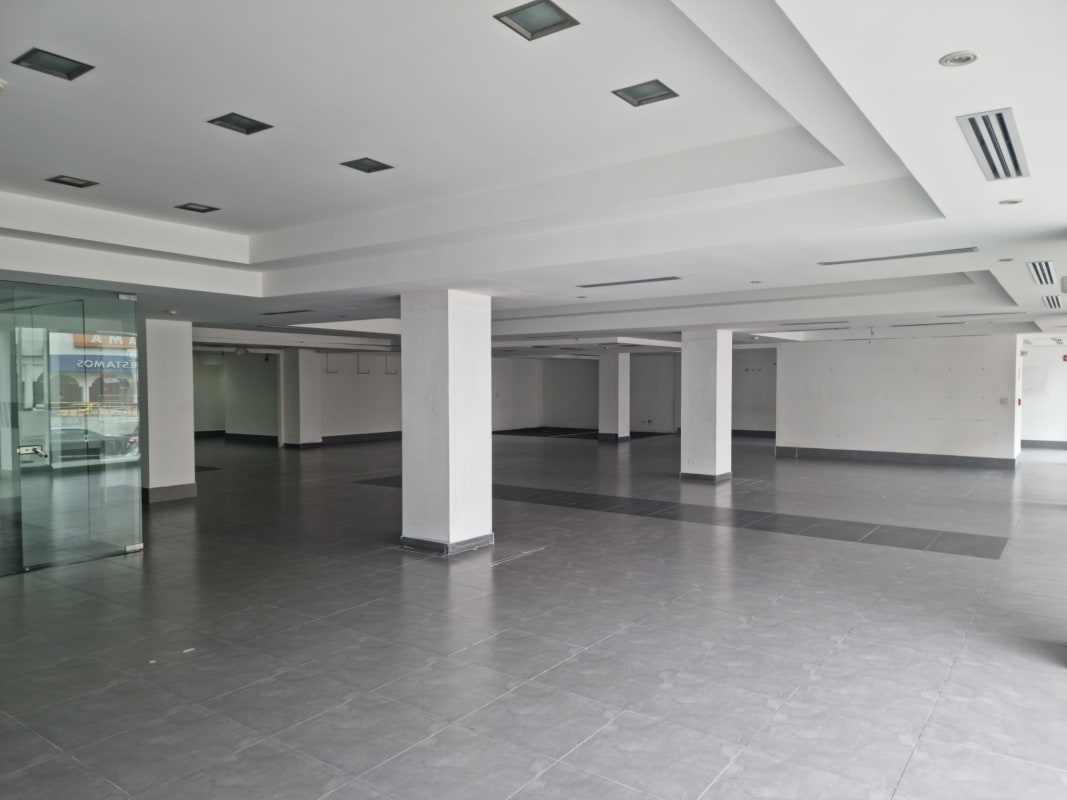 Interior office space with glass partitions in commercial building Via España Bella Vista Panama