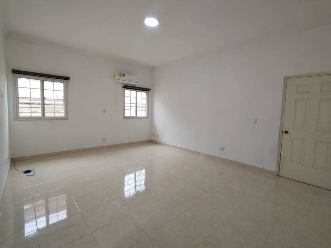 Spacious bright living room with tile floor, high ceilings, large windows in luxury Ancón Rainforest villa