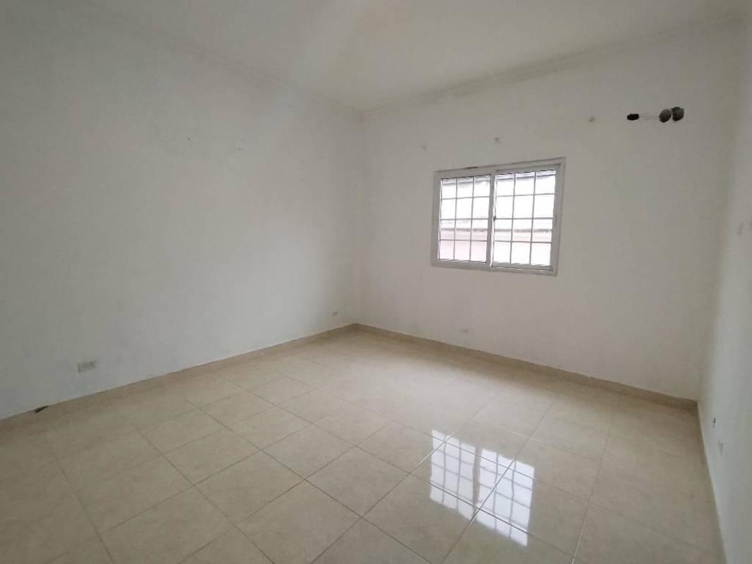 Spacious kitchen featuring granite countertops, dark cabinets, stainless appliances in Residencial Las Huacas Panama City