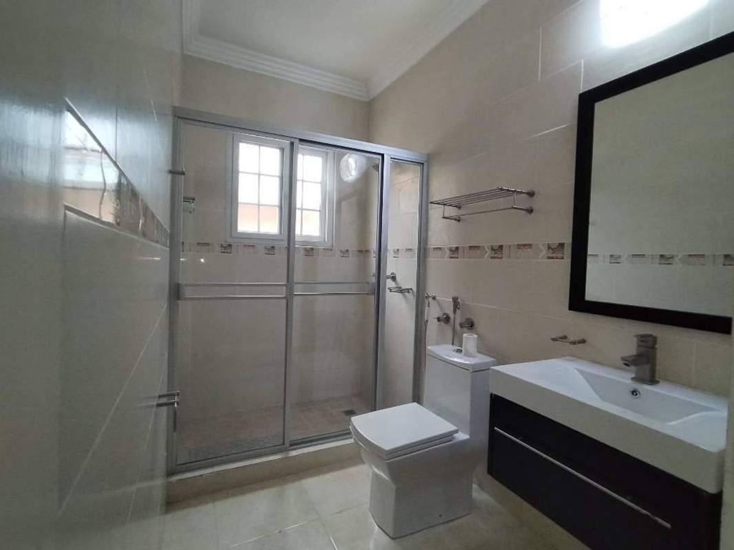 Family-friendly playground with slides, swings, green areas in Rainforest Villas Ancón