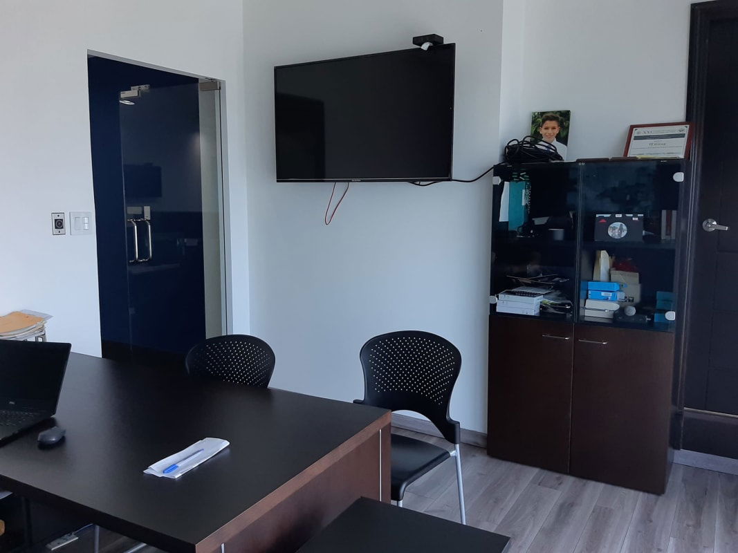 Private glass-partition office in PH Ocean Club Panama overlooking city skyline and bay