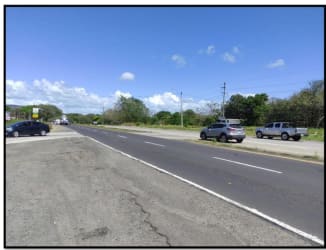 Wide driveway with secured entry leading to commercial mini storage property in Chame Panama