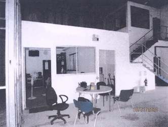 Open farmland plot with warehouse structures in rural Los Santos Panama