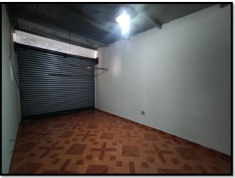 Empty garage storage with tile floors and roll-up doors in mini warehouse property Nueva Gorgona Panama