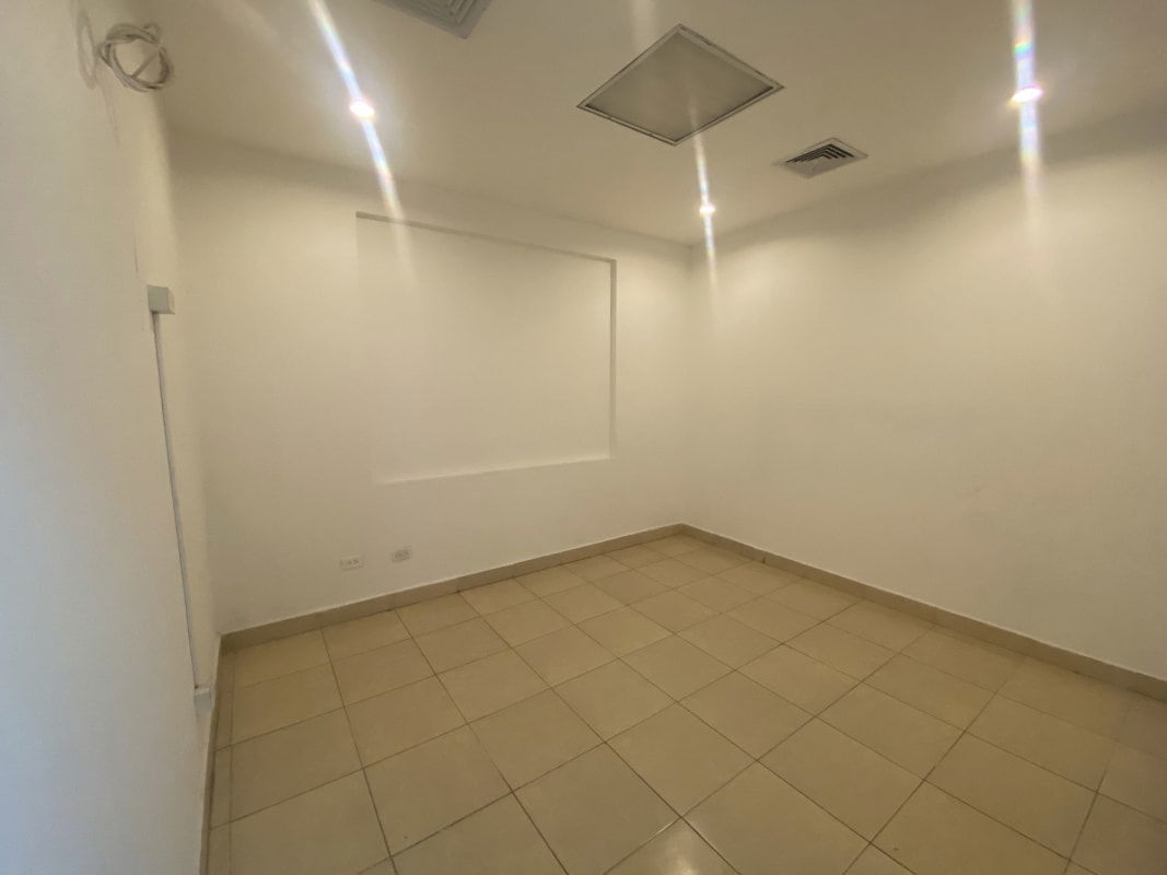 Compact office room with light tiles, recessed lighting in PH Bella Vista Tower Panama City