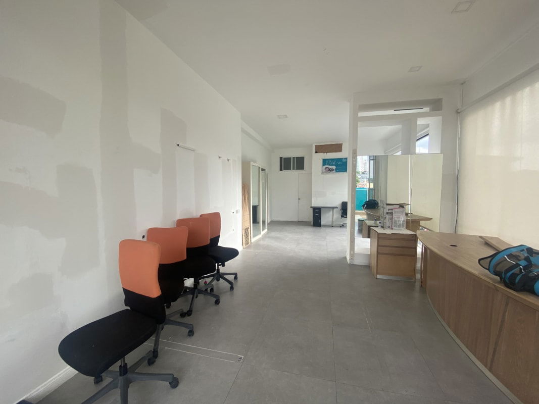 Modern bright commercial space with white tiles and glass frontage in Flor Plaza Bella Vista