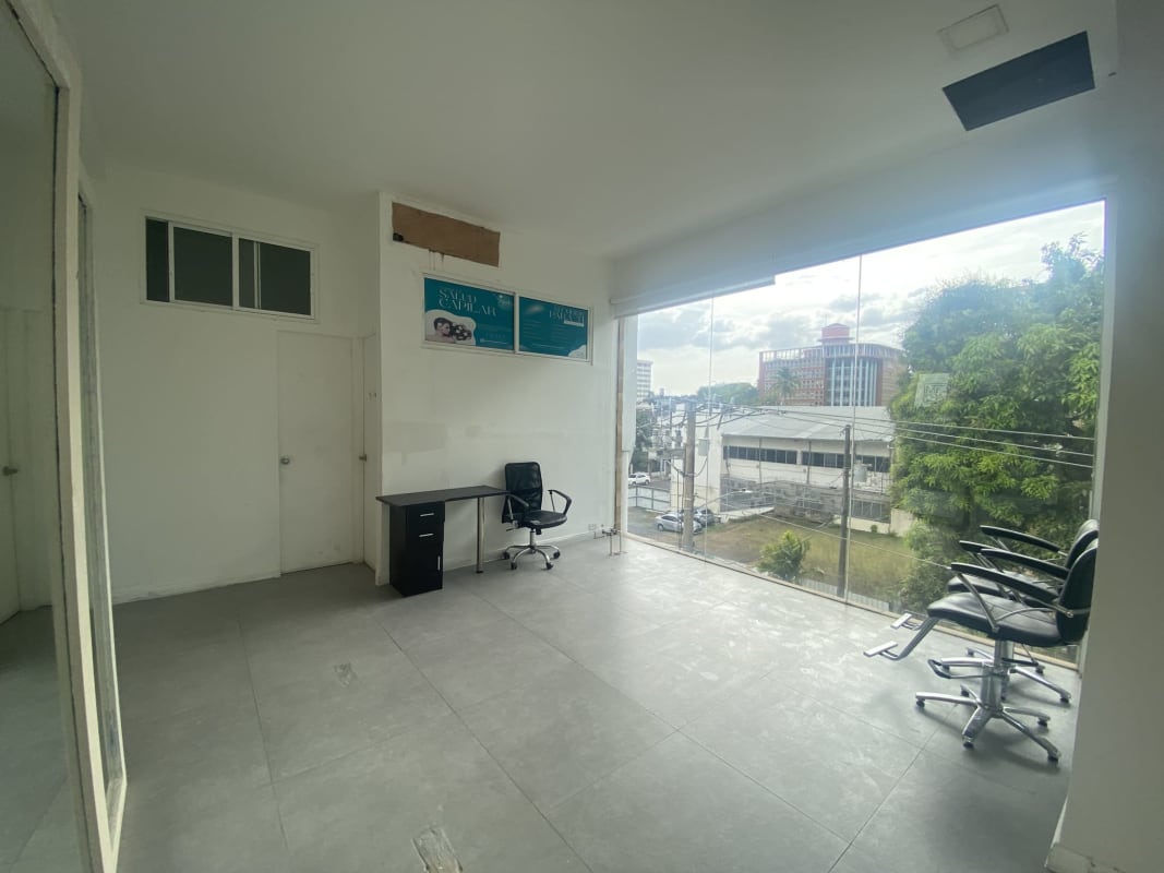 Bright modern office with panoramic glass windows overlooking Bella Vista Panama City