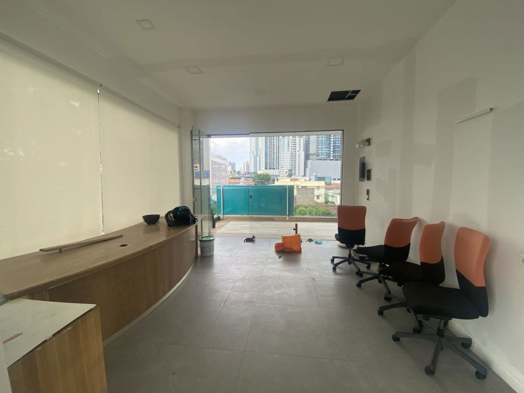 Reception desk with floor-to-ceiling windows at Flor Plaza commercial unit in Bella Vista Panama