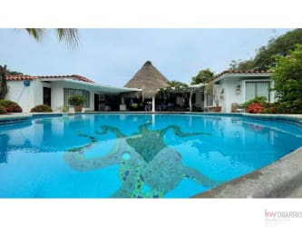 Mediterranean tropical villa with mosaic pool, lush gardens, and patio Punta Barco Panama