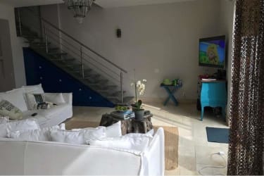 Spacious living room with modern decor, staircase, and garden views Punta Arenas Buenaventura Panama