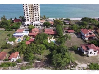 Contemporary master bedroom with air conditioner balcony access sea view Nueva Gorgona beach house