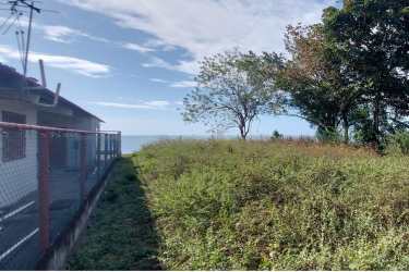 Fence along coastal lot with ocean view and trees at Juan Hombrón Panama
