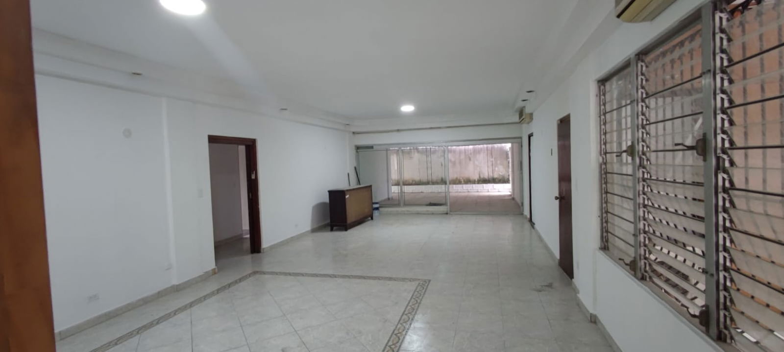 Spacious living area with windows and tiled floor in Obarrio home for sale