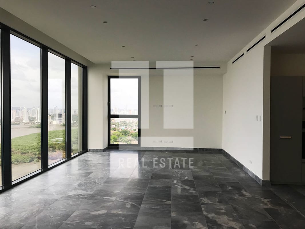 Spacious modern living room with floor to ceiling glass and ocean view terrace Upper East Tower Panama