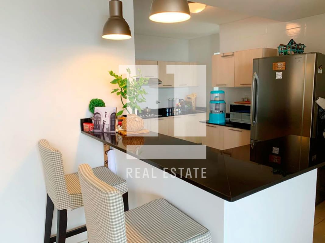 Bright updated kitchen with black granite counters and appliances Foresta Tower Panama