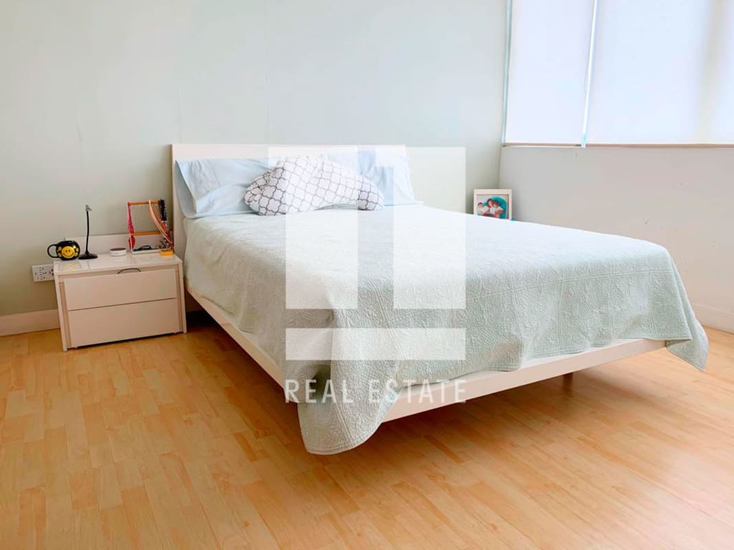 Bedroom with minimalist decor, natural light Foresta Tower apartment Panama City