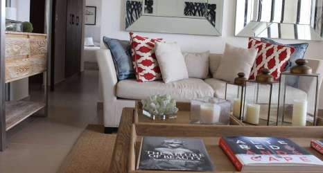 Coastal themed living room with natural light and sliding doors Playa Malibu Panama