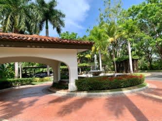 Modern bedroom with balcony overlooking gardens in Buenaventura condo