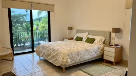 Spacious bright bedroom opening onto balcony in Buenaventura Panama