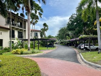 Bathroom with beige tiles, glass shower, vanity mirroring luxury details in Buenaventura condo