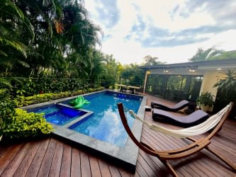 Modern backyard with private pool and tropical plants Buenaventura Paseo de las Casas