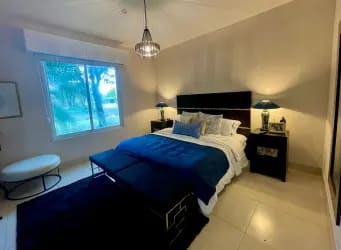 Large window bedroom with navy decor Paseo de las Casas Buenaventura Panama
