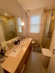Updated bathroom with glass shower Paseo de las Casas beach condo