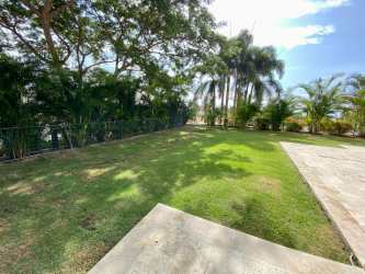 Covered terrace and garden at ground floor beach condo Casamar Panama
