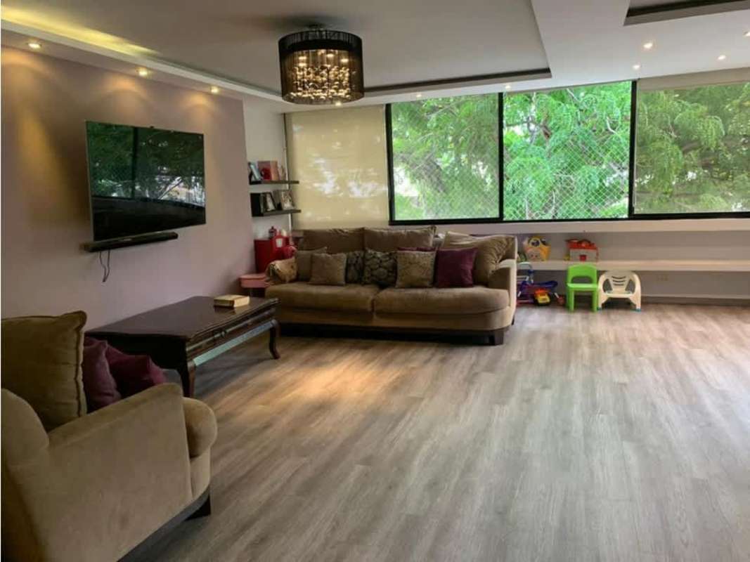 Spacious remodeled living room with large windows city skyline view in PH Barlovento Punta Paitilla Panama