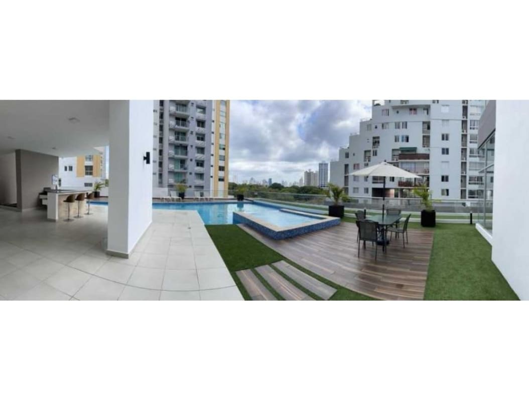 Covered pergola patio with grill, hammock, picnic table at Park Point condominium Panama City