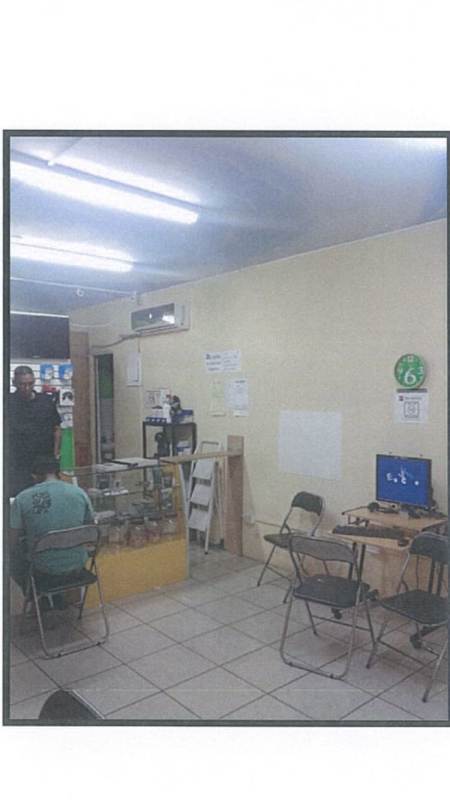 Reception or waiting area with glass counter and folding chairs in commercial property in Panama
