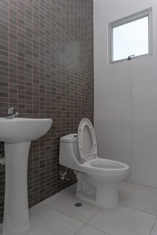 Private balcony with glass railing and skyline view from apartment at PH Trinity Panama City