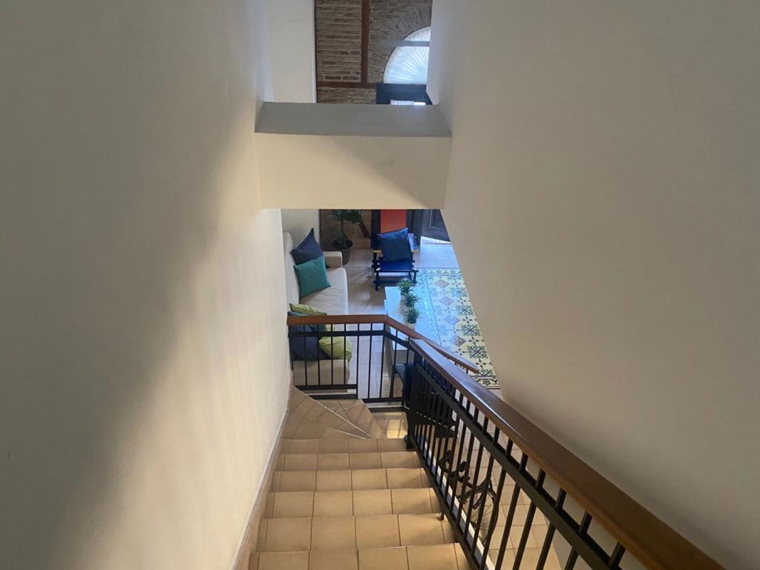 Artistic tiled staircase with iron railing inside colonial apartment Casco Viejo Panama