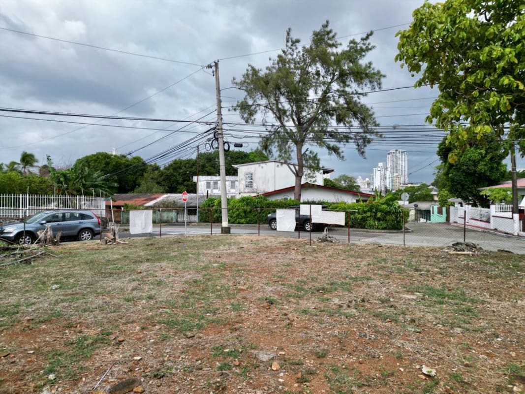 Urban neighborhood street view with corner lot fenced in Betania Panama City