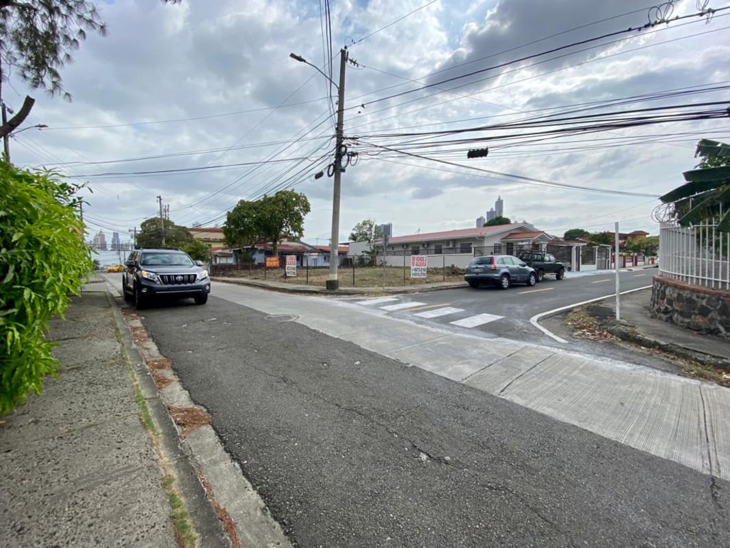 Urban vacant land with fence on paved city street in Betania Panama