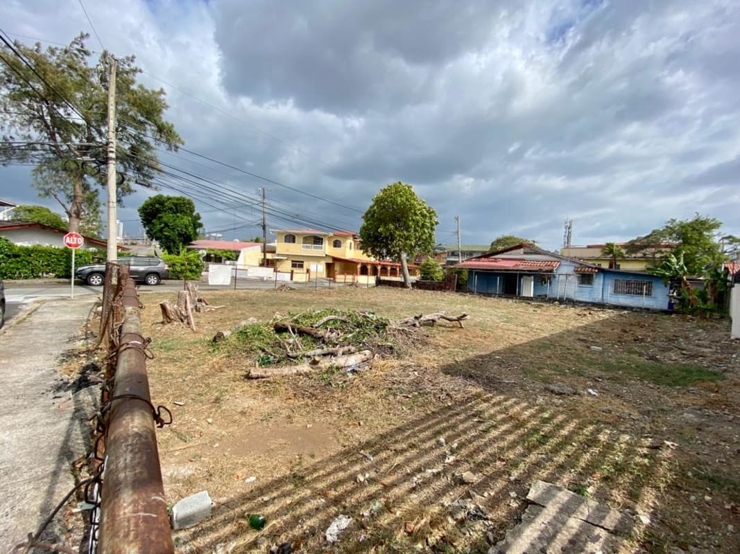 Aerial showing homes and commercial street near vacant lot Betania Panama