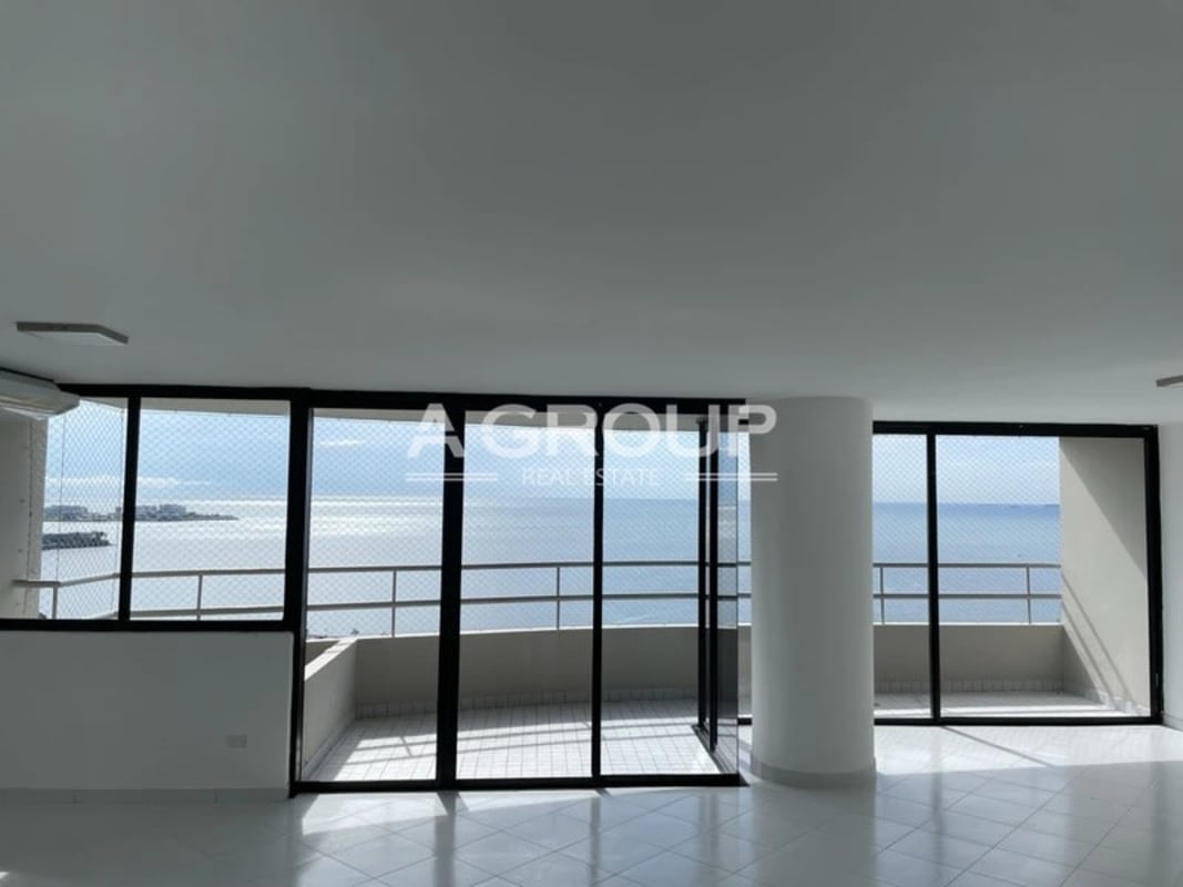 Large curved balcony with panoramic ocean bay views at PH La Ensenada Panama