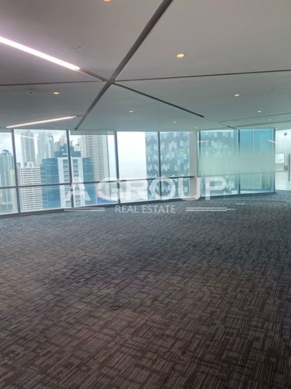 Interior modern office with full glass walls and panoramic city views in Financial Park Tower