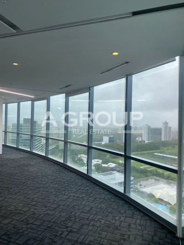 Spacious open-plan corporate office with floor-to-ceiling windows and skyline views at Costa del Este Panama