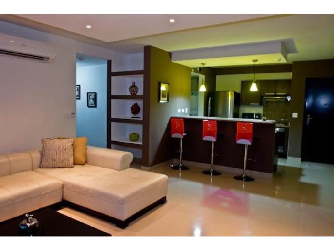 Open concept kitchen with granite counters and breakfast bar, integrated with living area in PH Top Towers Costa del Este Panama