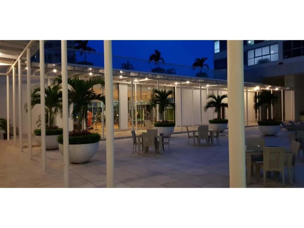 Modern condo exterior terrace with seating, planters and ambient lighting Costa del Este Panama