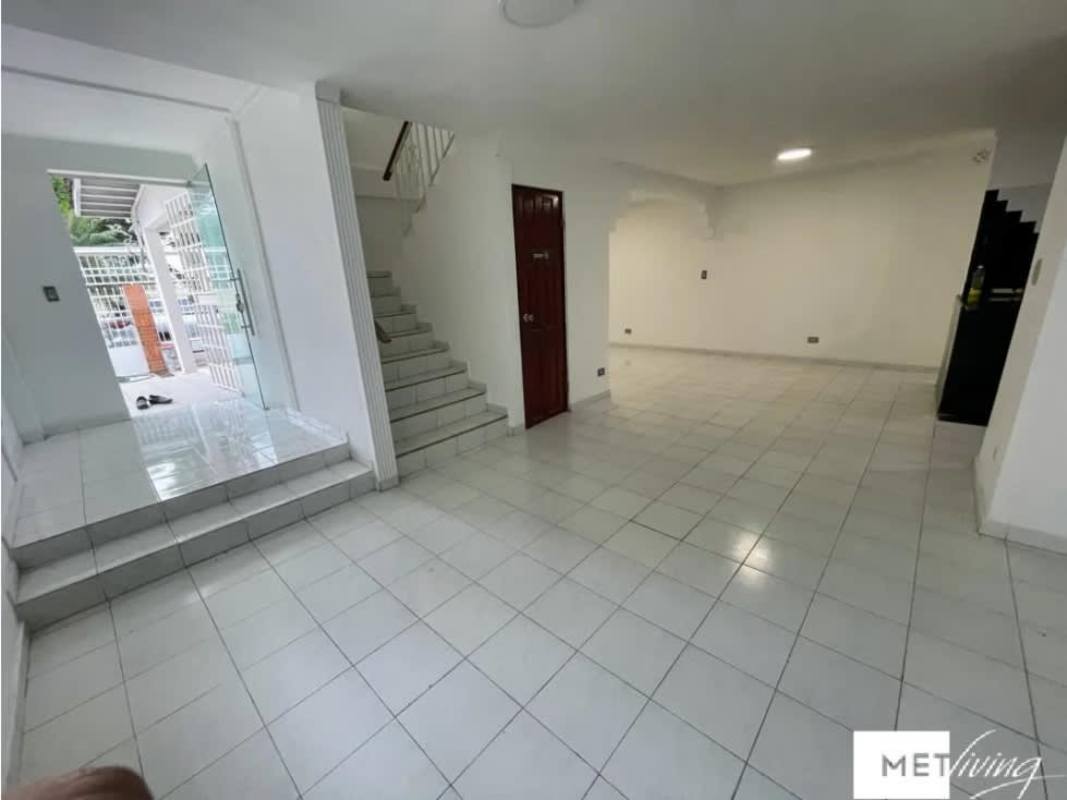 Living space with ceramic floor, kitchen with black backsplash in Duplex La Fontana Chanis Panama